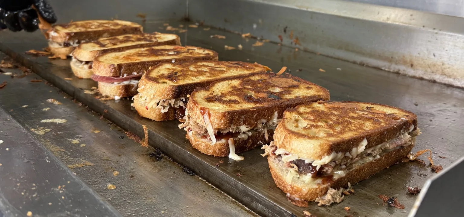 A line of hot grilled sandwiches